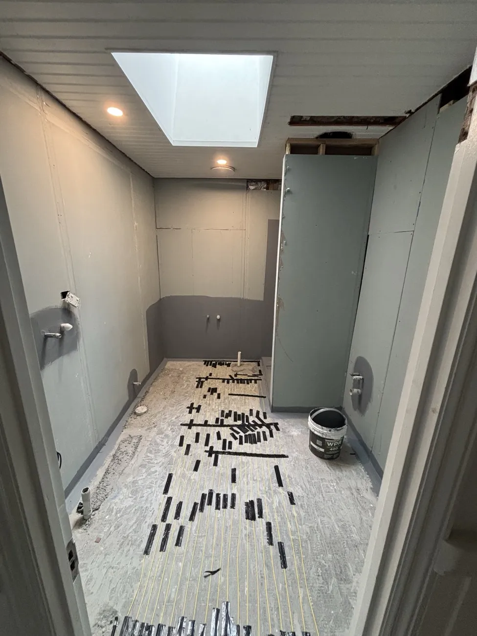 Heated flooring installed under large format tile